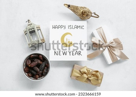 Card with text HAPPY ISLAMIC NEW YEAR, gift boxes, fanous and dried dates on light background Royalty-Free Stock Photo #2323666159