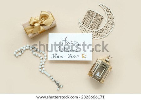 Card with text HAPPY ISLAMIC NEW YEAR, tasbih, gift box and crescent on color background Royalty-Free Stock Photo #2323666171