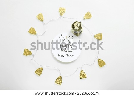 Card with text HAPPY ISLAMIC NEW YEAR, fanous and garland on light background Royalty-Free Stock Photo #2323666179