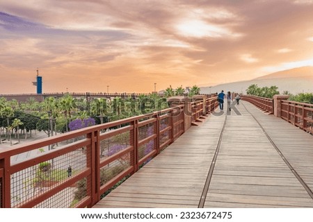 Wooden railway walk with embedded train rails (El Cable Ingles in Almería) Royalty-Free Stock Photo #2323672475