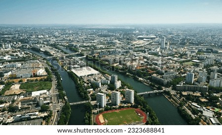 Aerial view of Saint-Denis involving the Seine River and famous Stade de France stadium to the north of Paris, France Royalty-Free Stock Photo #2323688841