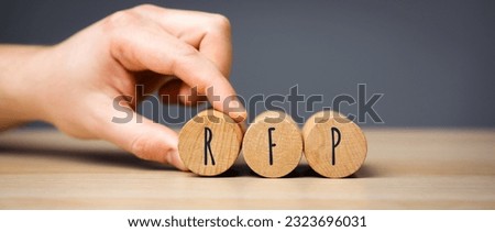 RFP wooden blocks - Request For Proposal. A documented request from an organization that is interested in acquiring goods or services. Business and finance concept Royalty-Free Stock Photo #2323696031
