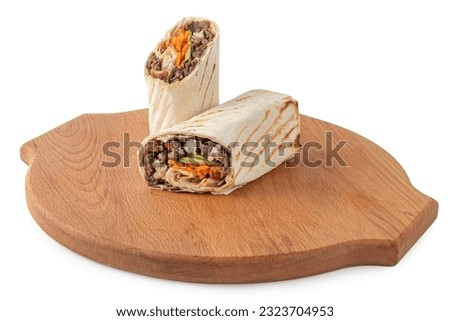 Shawarma, sandwich, gyro, fresh roll of lavash, doner kebab. Beef, pickled cucumber, carrot. Served on wooden plate, white isolated background. Traditional Eastern oriental snack, street food menu.
