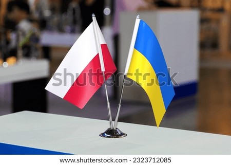 Flags of Poland and Ukraine together at some event or fair. Flags of the two countries as a symbol of cooperation between the two states. Joint business of Ukraine and Poland