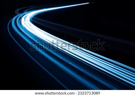 blue car lights at night. long exposure Royalty-Free Stock Photo #2323713089