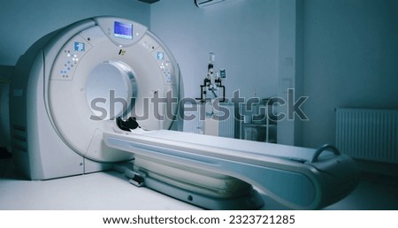 Shoot without people. View of steryl tomography room. Medical equipment for MRI. Scanning capsule for magnetic resonance imaging sexamination. Modernly equipped brain MRI room. Royalty-Free Stock Photo #2323721285
