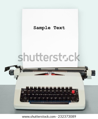 Retro style picture of old typewriter with paper and space for your text.