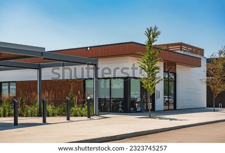 Photo of the mall shopping street in North America. Exterior of a new shopping centre building. Mall complex outdoor. Nobody, street photo Royalty-Free Stock Photo #2323745257