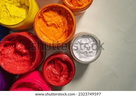 
Top view Collection of colorful smooth gradient background for print fabric and tee shirt. graphic design. 
various colors for shirt printing packed in glass bottles lined up.colorful background.
 Royalty-Free Stock Photo #2323749597