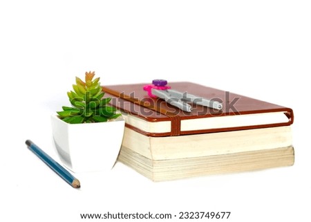 Note book and pencil put on white background with concept isolated picture.education picture style three books put layers.copy space.