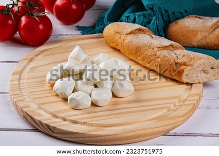 buffalo mozzarella balls, red tomatoes and bread