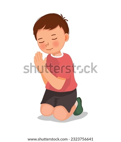 Cute little boy praying kneeling on her knee