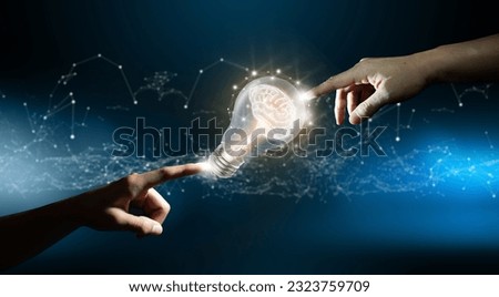 Hands pointing a brain inside a light bulb. Circuit converging point background. Business bright idea, Great idea for success, and Mixed media Concept. Royalty-Free Stock Photo #2323759709