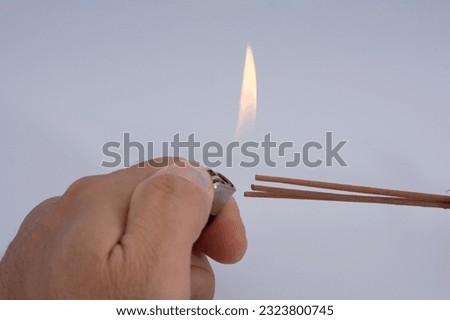 Light an incense with a lighter