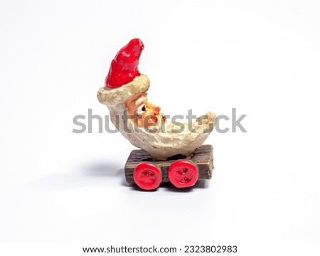 old Christmas doll on white background