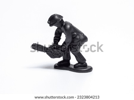 black firefighter doll on white background