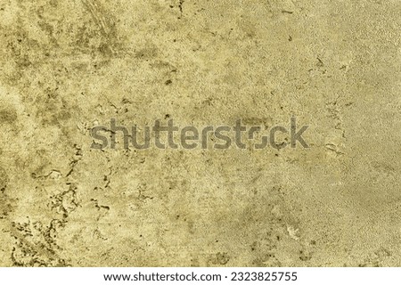 Texture of golden decorative plaster or concrete. Abstract gold grunge background for design.
