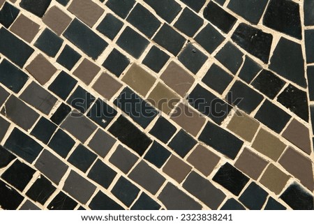 Colorful ceramic mosaic on the walls of the building. Abstract background and texture for design.