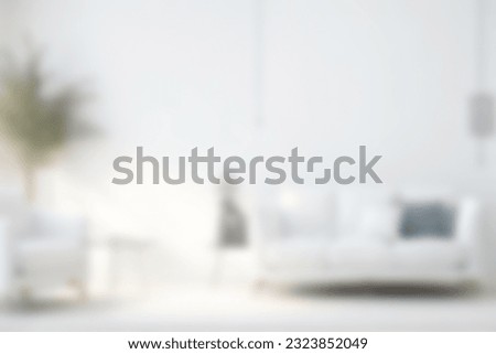 Blur image of living room with furniture at home with sunlight for background usage. blur interior concept.