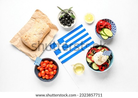Composition with flag of Greece and different food on white table