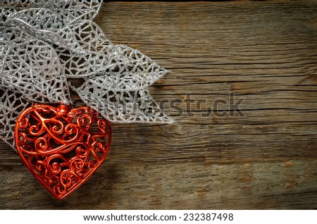Valentine's day background with heart on a dark wood background. tinting. selective focus