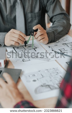 Construction and structure concept of Engineer or architect meeting for project working with partner and engineering tools on model building and blueprint in working site.