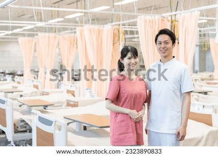 Asian health care workers in hospital Royalty-Free Stock Photo #2323890833