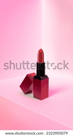 Beautiful red lipstick with red background.