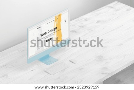 Computer display with web desing studio page on white wodden desk. Showcase composition. Modern blue display