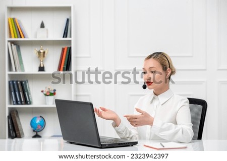 customer service cute blonde girl office shirt with headset and computer looking at screen