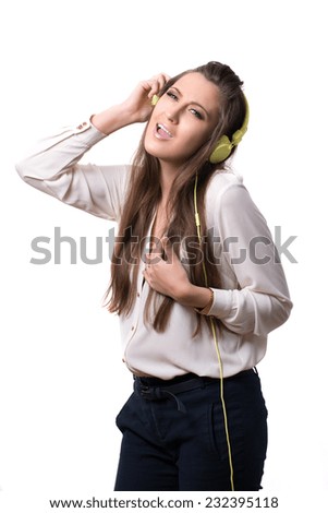 funny girl listening to music on headphones