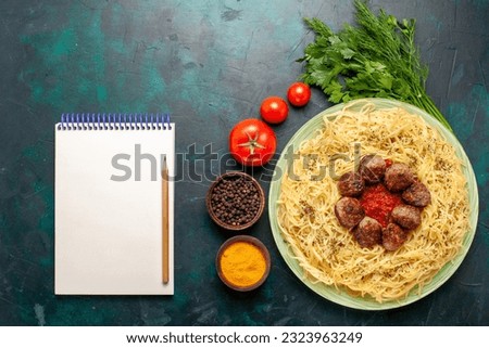 top view tasty italian pasta with meatballs notepad and different seasonings on dark-blue background meal pasta food dinner dish dough
