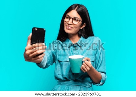 young hispanic woman having a coffee
