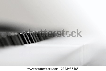 Close-up of a piano keyboard. Blurred background, very shallow depth of field.