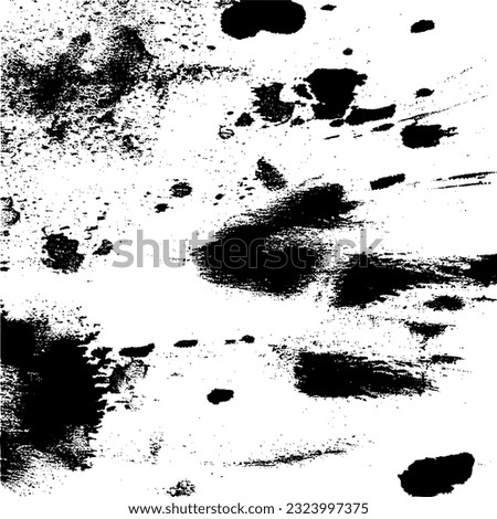 Marks and blots black grunge artwork on a clean white sheet