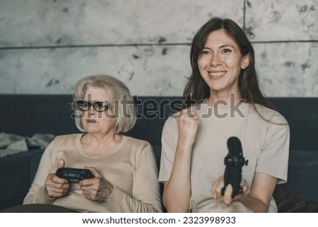 Smiling woman with gamepad playing video game