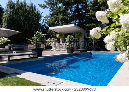 Dive into luxury with our stunning swimming pool and modern backyard design. Experience architectural excellence and captivating beauty. Pictures taken by drone for an extraordinary perspective.




 Royalty-Free Stock Photo #2323999693