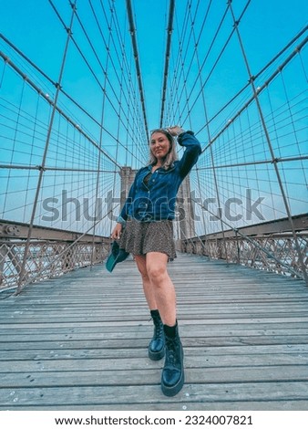 tourist woman on Brooklyn Bridge in New York