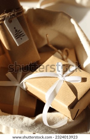 Abstract Selective Focus View of Decorated Gift Boxes in Linen Bag. Scandinavian Design Christmas Advent Calendar.