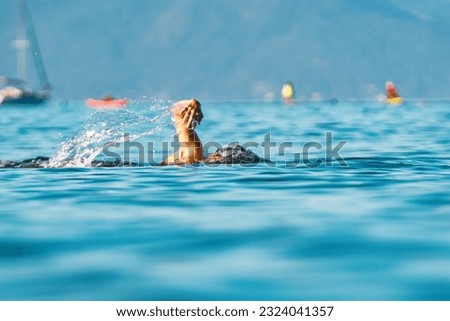 Open water swimmers at summer Royalty-Free Stock Photo #2324041357