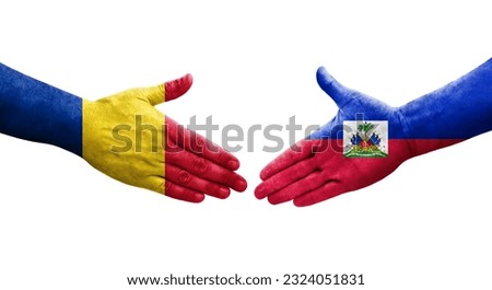 Handshake between Haiti and Romania flags painted on hands, isolated transparent image.