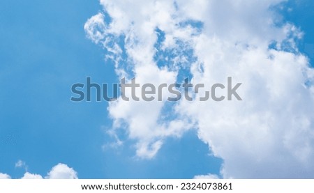 Blue sky with clouds. Bottom up view of sky. Cloudy sky photo for your designs. Royalty-Free Stock Photo #2324073861
