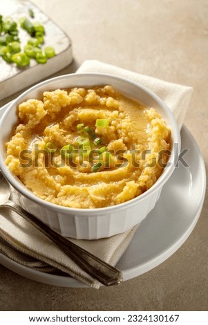 Root mash. Root vegetables mashed in a bowl. Garnished with oil and herbs. Royalty-Free Stock Photo #2324130167
