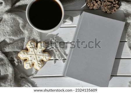 Blank book cover for mock up winter theme coffee and snowflake cookie. 