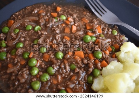 Mince and tatties with a fork on a plate. Traditional Scottish food. Popular dish in Scotland. 