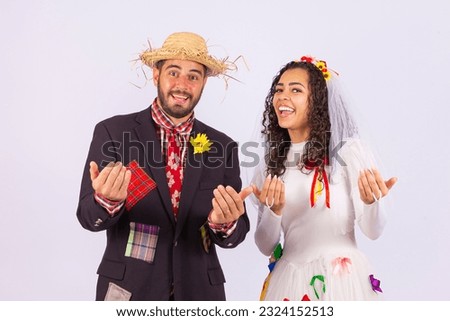 Brazilian couple, wearing June party clothes, fraternization in the name of São João, Arraial. close-up photo.
