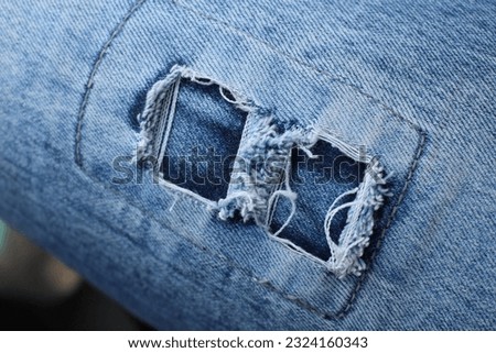Close-up of shredded jeans background