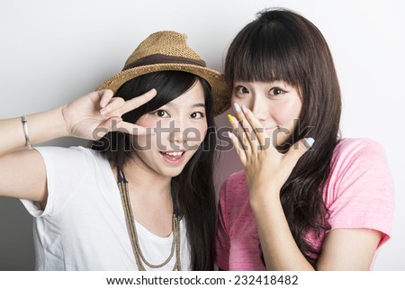 Two smiling asian girl,isolated on white background