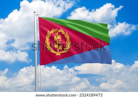Eritrea national flag waving in the wind on clouds sky. High quality fabric. International relations concept