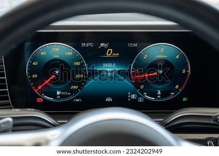 car dashboard with speedometer steering wheel 